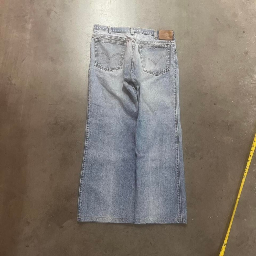 Vintage 80s light wash men's Levi's for men with a slosh more room bootcut jeans